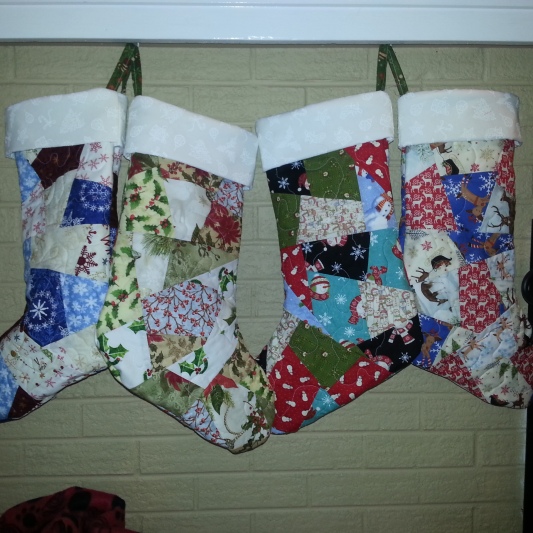 Crazy Quilt stockings- each has it's own theme- with a matching tree skirt incorporating all themes!